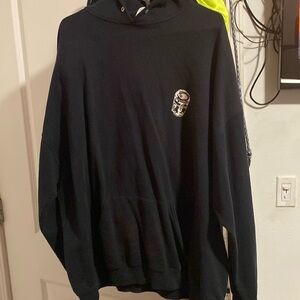 Black hoodie with a tear on the pocket!